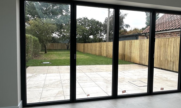 Sliding doors lead out on to private garden